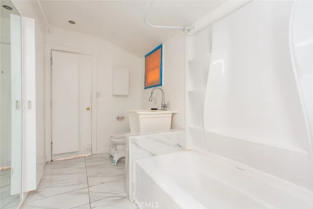 a hallway with washer and dryer