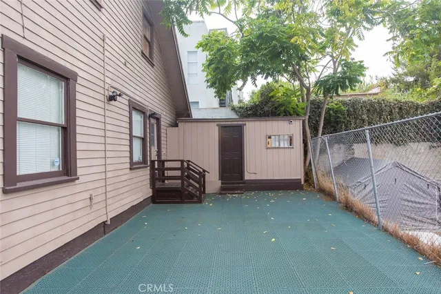 an ocean view of a house with swimming pool and a yard