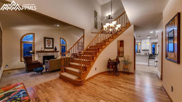 4995 Neal Ranch Road Colorado Springs, CO 80906 - Photo 3 of 8 Grand Front Entry with Hardwood and Curved Staircase