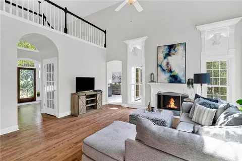 a view of hallway with wooden floor