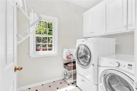 a bathroom with a sink vanity mirror and toilet