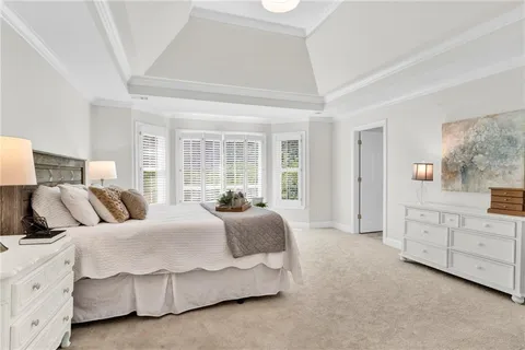 a living room with furniture a rug and a window
