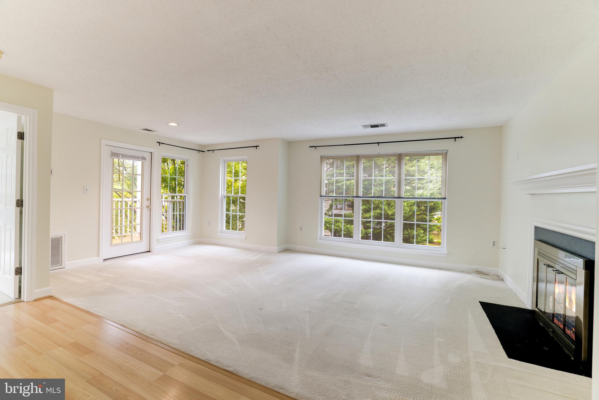 20977 Timber Ridge Terrace, Unit 204 Ashburn, VA 20147 - Photo 2 of 27 Living & Dining Rooms