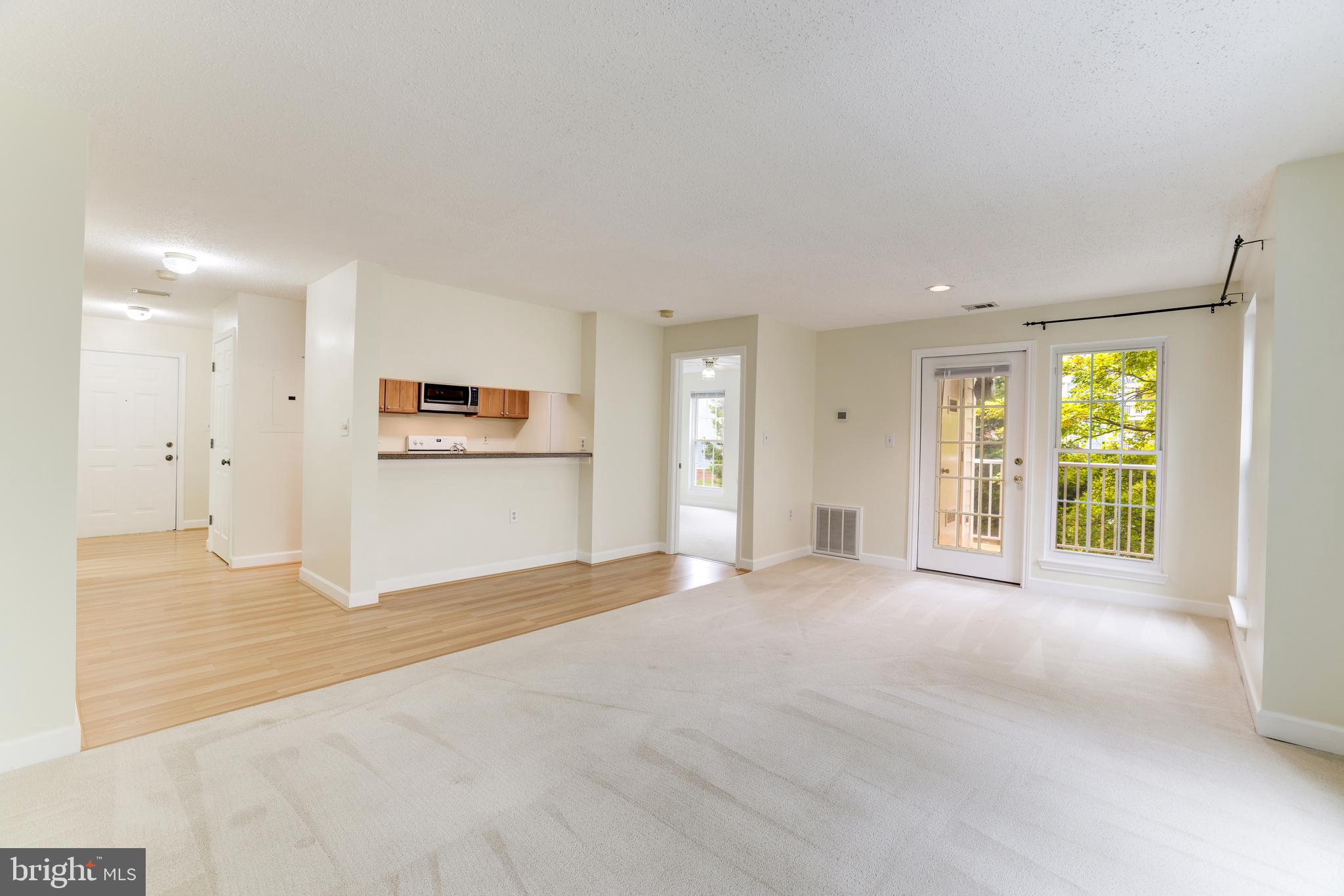 20977 Timber Ridge Terrace, Unit 204 Ashburn, VA 20147 - Photo 6 of 27 Living & Dining Rooms