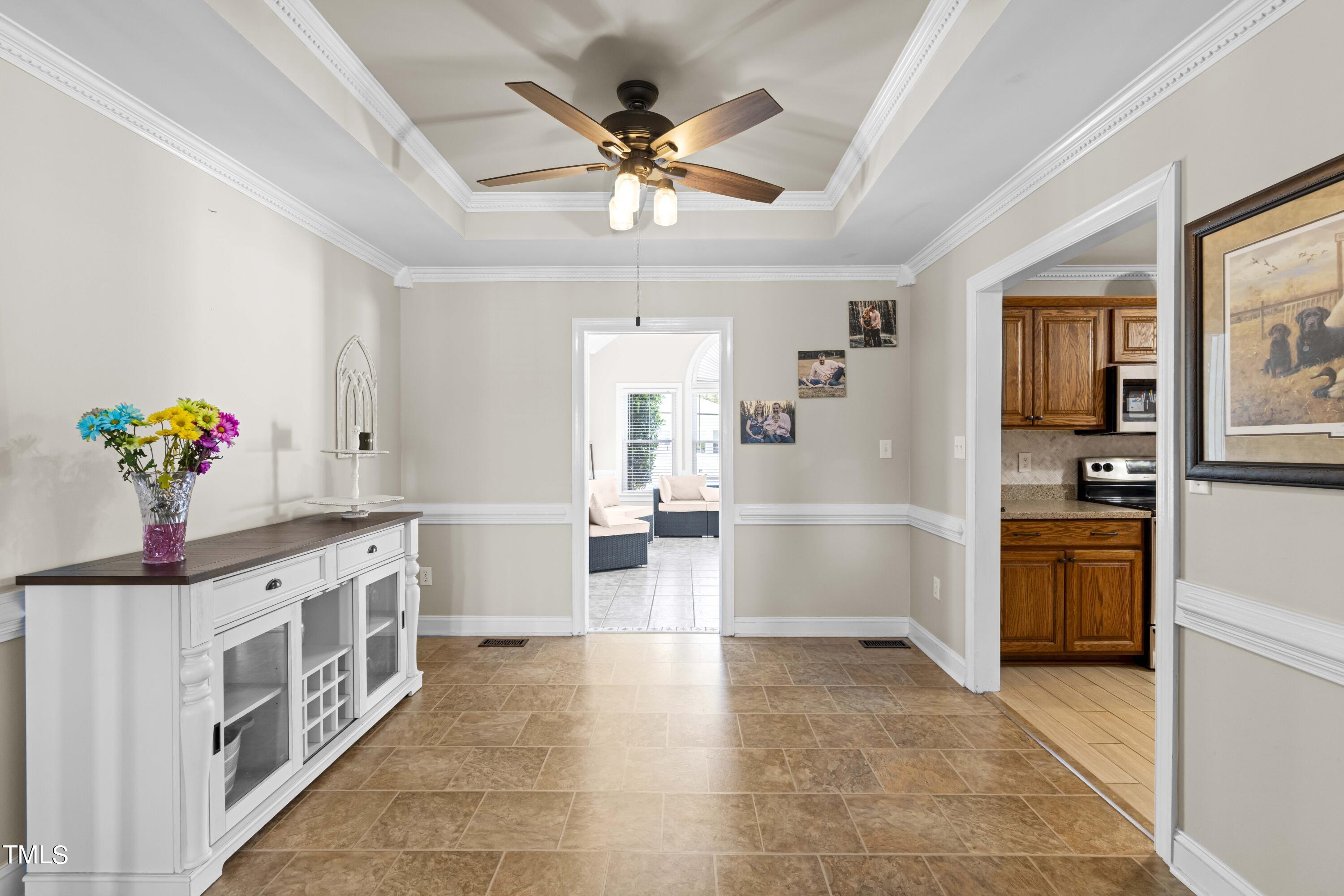 44 Oak Hill Drive Dunn, NC 28334 - Photo 21 of 40 a kitchen with stainless steel appliances a stove a refrigerator and a sink
