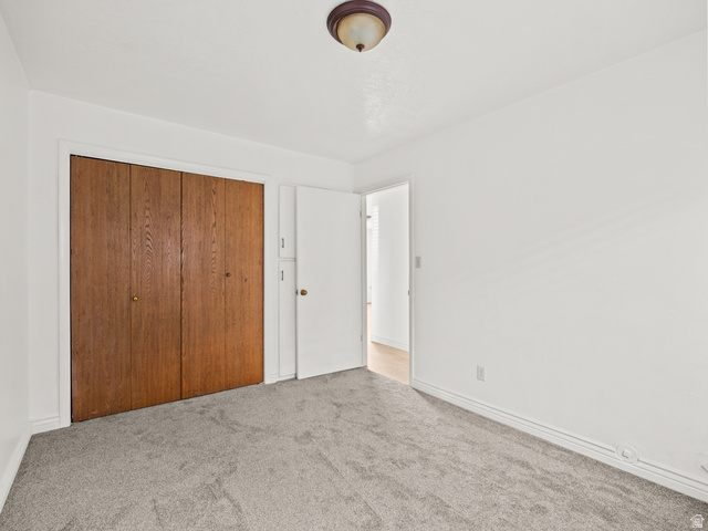 460 200 South Provo, UT 84606 - Photo 25 of 66 Unfurnished bedroom featuring carpet floors and a closet