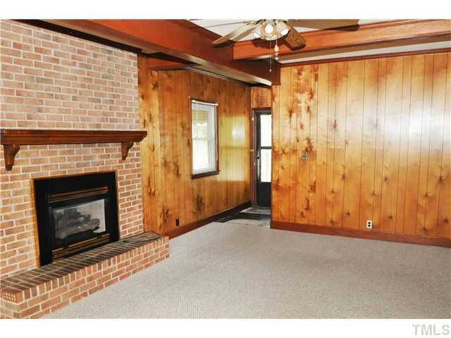 5554 Elevation Road Benson, NC 27504 - Photo 11 of 21 Spacious den with masonary fireplace with gas logs.