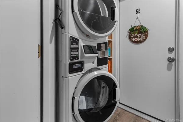 a close view of a utility room with dryer and washer