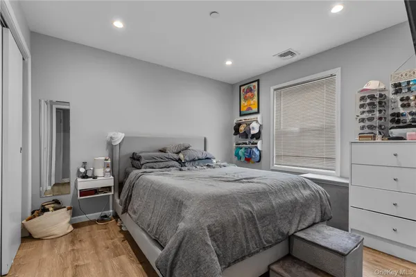 a bedroom with a bed and closet