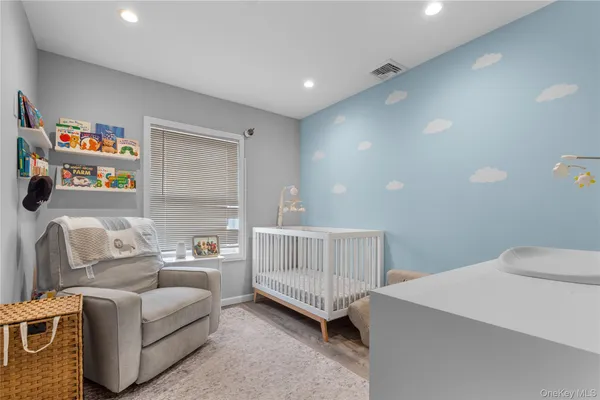 a bedroom with furniture and a window