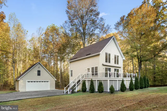 a view of a balcony with wooden floor and fence