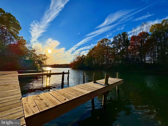 a view of a lake with wooden floor