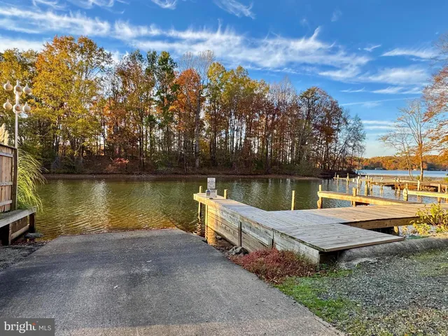 a backyard of a house with a lake view