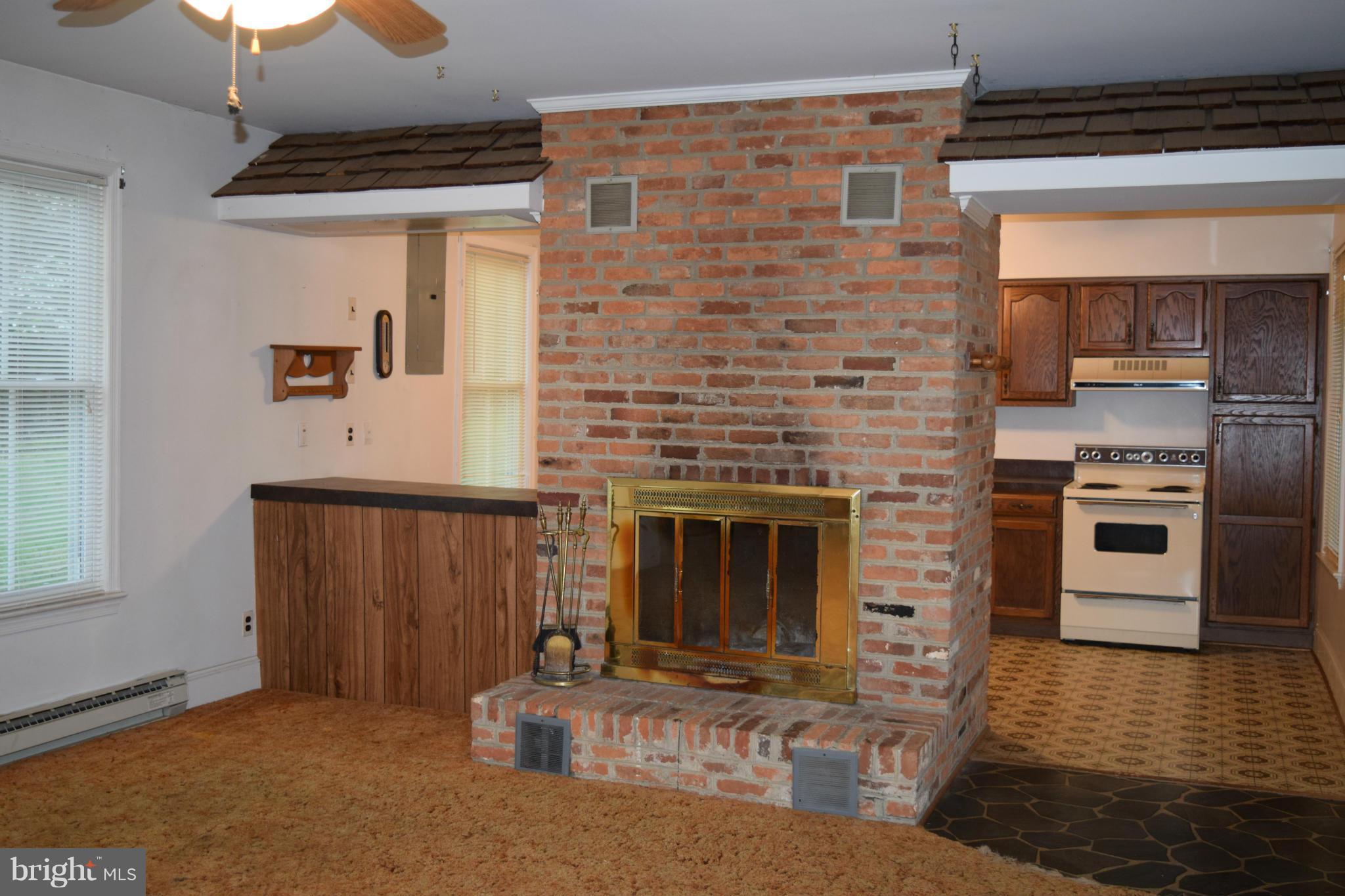 110 Persistence Lane Castleton, VA 22716 - Photo 15 of 24 a kitchen with a refrigerator and a stove