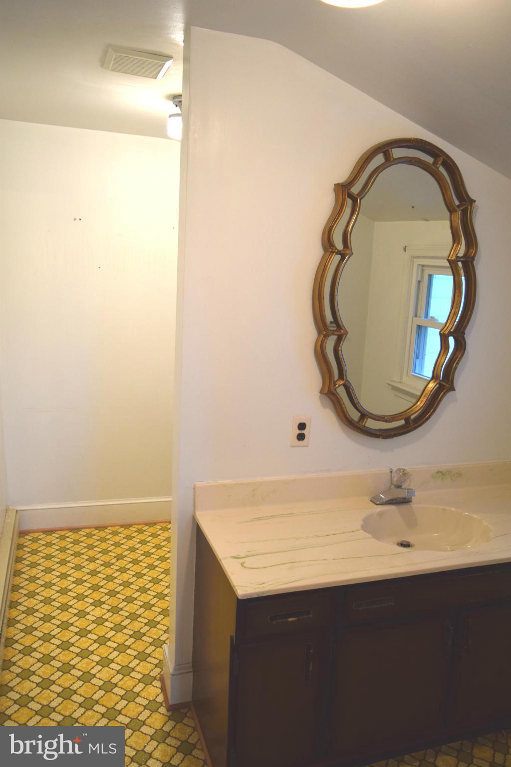 110 Persistence Lane Castleton, VA 22716 - Photo 20 of 24 a bathroom with a sink and a mirror