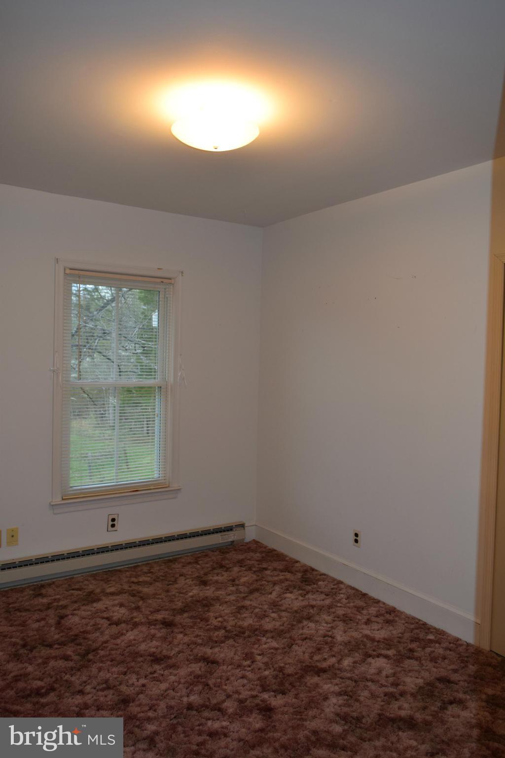 110 Persistence Lane Castleton, VA 22716 - Photo 21 of 24 an empty room with a window