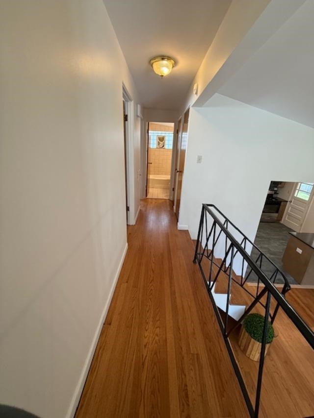 939 South Grace Street Lombard, IL 60148 - Photo 12 of 26 a view of a hallway with wooden floor