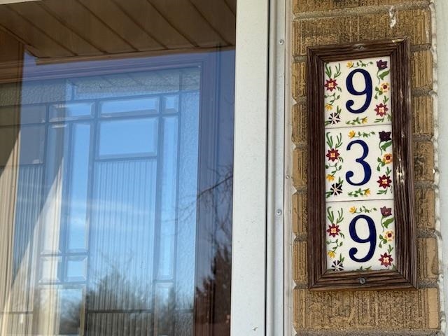 939 South Grace Street Lombard, IL 60148 - Photo 3 of 26 a sign that is on a wooden door