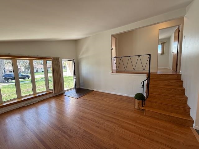 939 South Grace Street Lombard, IL 60148 - Photo 5 of 26 a view of an empty room with wooden floor and a window