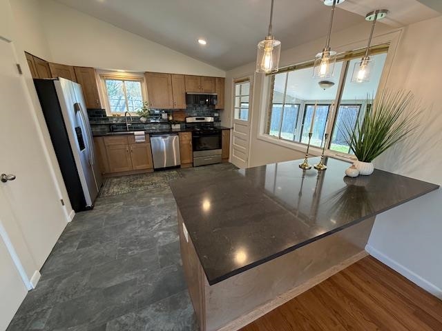 939 South Grace Street Lombard, IL 60148 - Photo 6 of 26 a kitchen with stainless steel appliances granite countertop a refrigerator a stove top oven a sink a dining table and chairs
