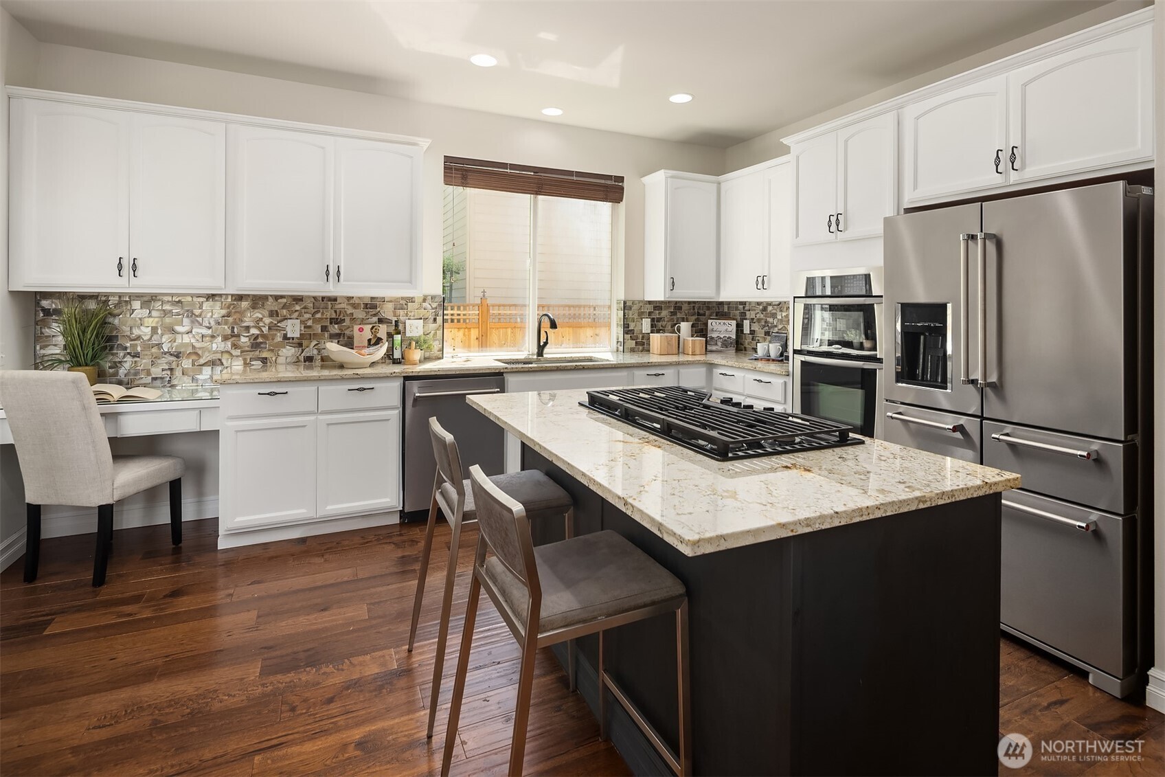 16148 Parkside Way Southeast Renton, WA 98058 - Photo 13 of 40 a kitchen with a stove a sink and a refrigerator