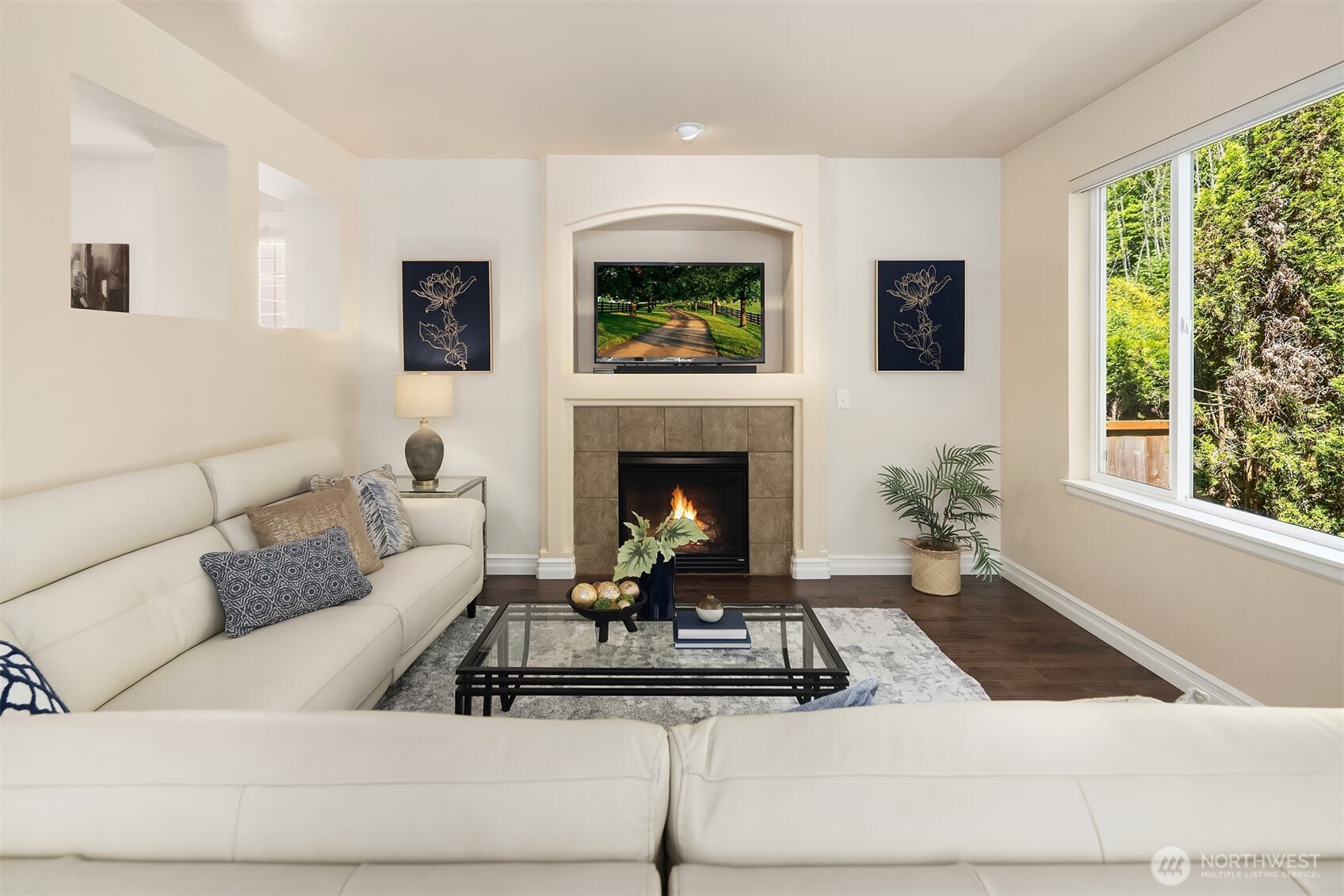 16148 Parkside Way Southeast Renton, WA 98058 - Photo 19 of 40 a living room with furniture a flat screen tv and a fireplace