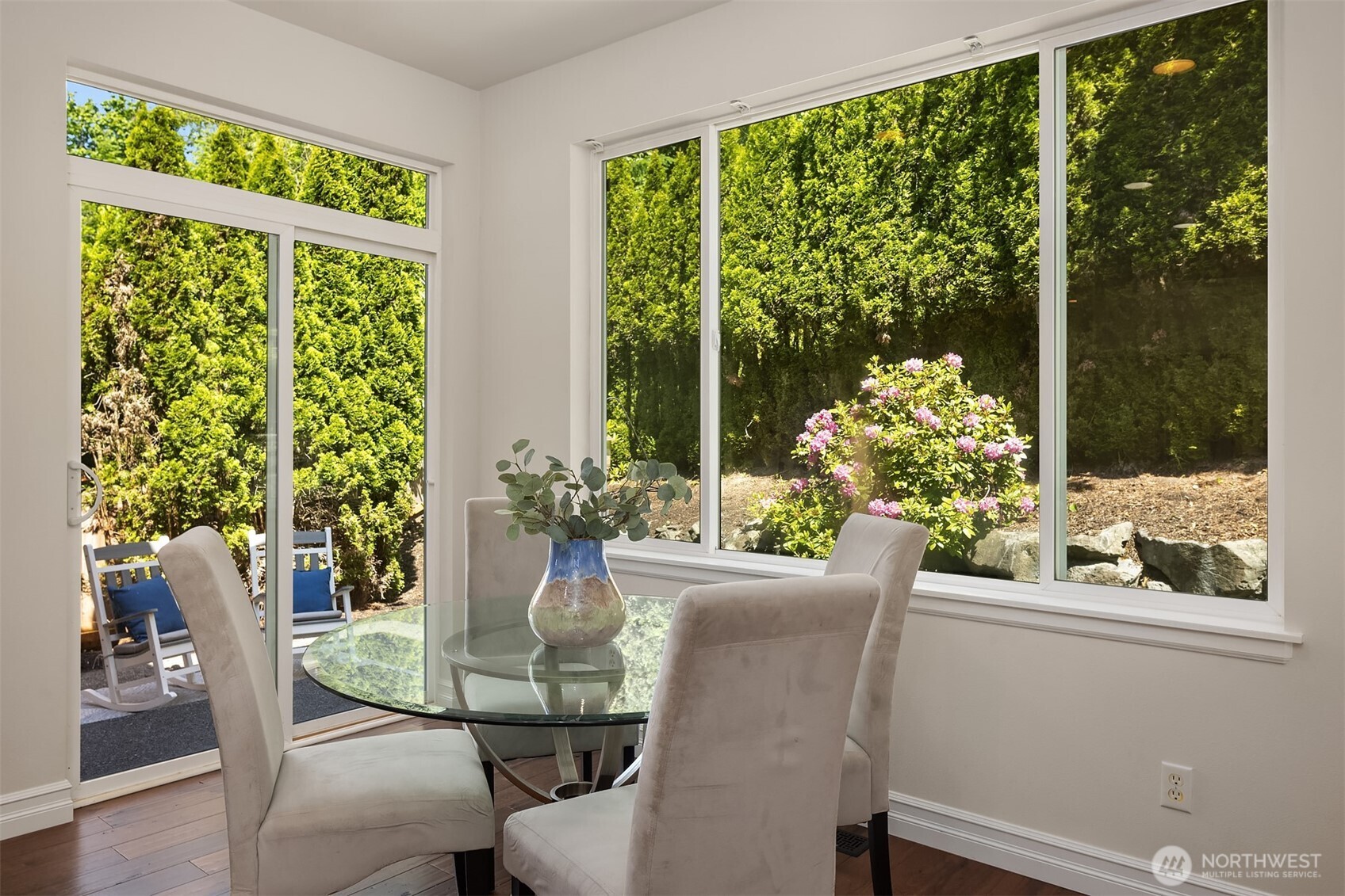 16148 Parkside Way Southeast Renton, WA 98058 - Photo 20 of 40 a view of a dining room with furniture window and wooden floor