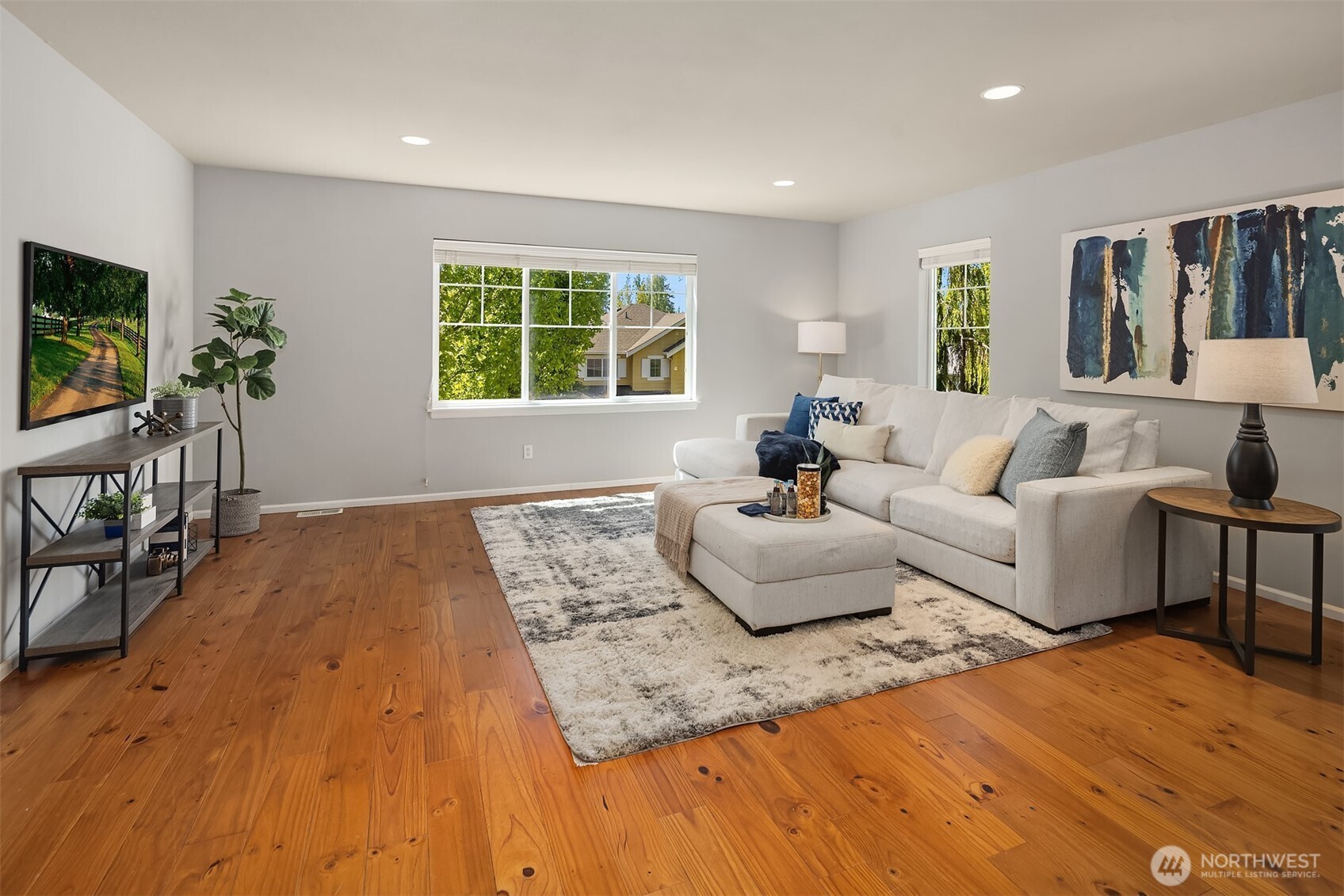 16148 Parkside Way Southeast Renton, WA 98058 - Photo 24 of 40 a living room with furniture and a flat screen tv