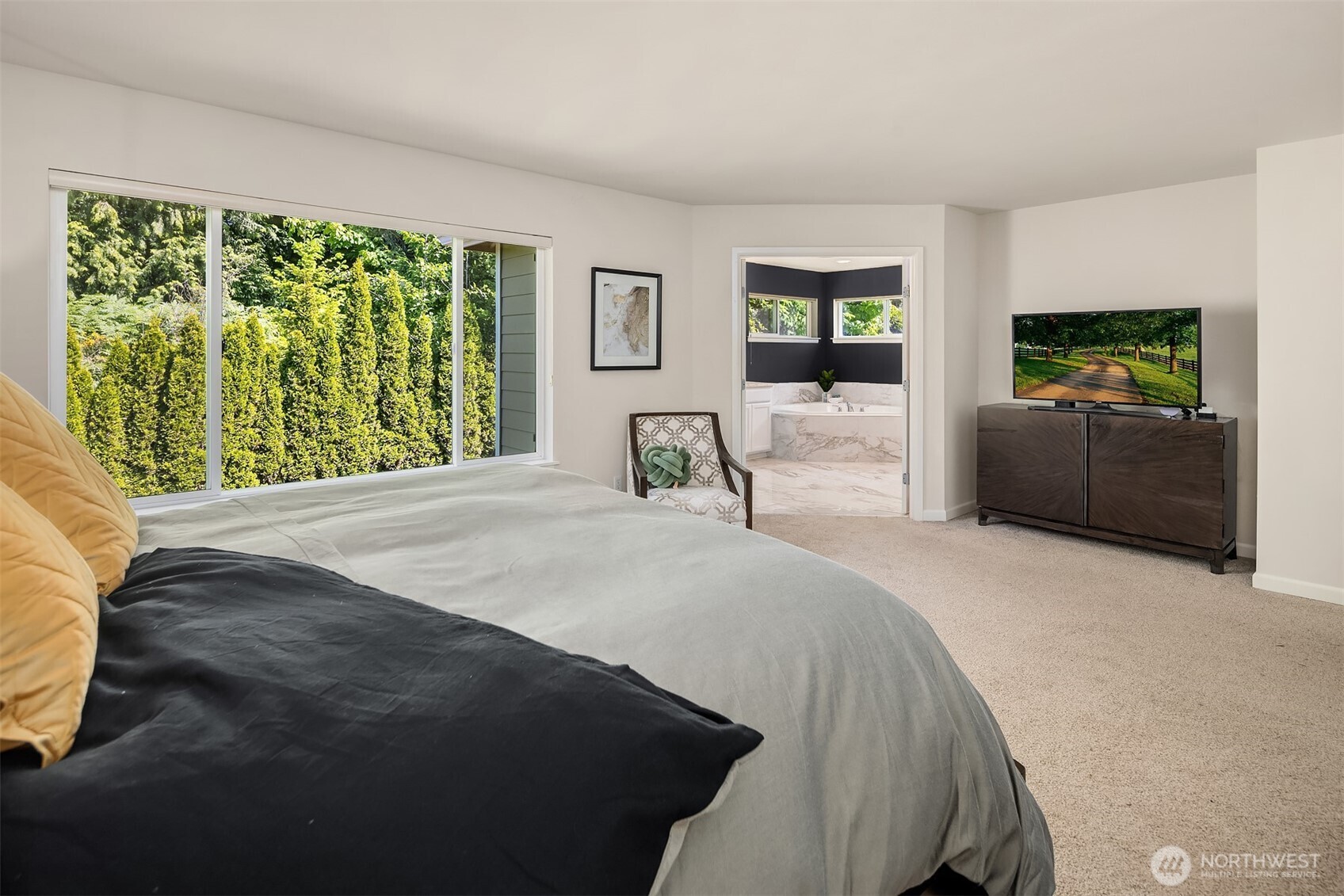 16148 Parkside Way Southeast Renton, WA 98058 - Photo 28 of 40 a bedroom with a bed and a flat screen tv