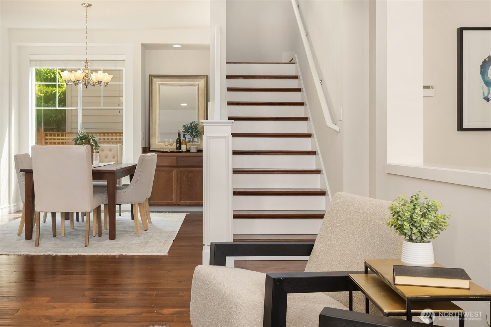 16148 Parkside Way Southeast Renton, WA 98058 - Photo 9 of 40 a view of a dining room with furniture window and wooden floor