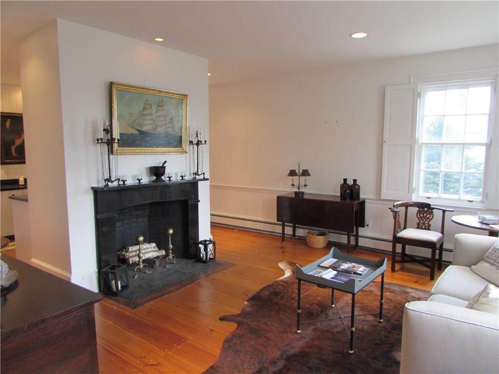 103 Main Street Castine, ME 04421 - Photo 9 of 35 Sitting area off kitchen with fireplace.
