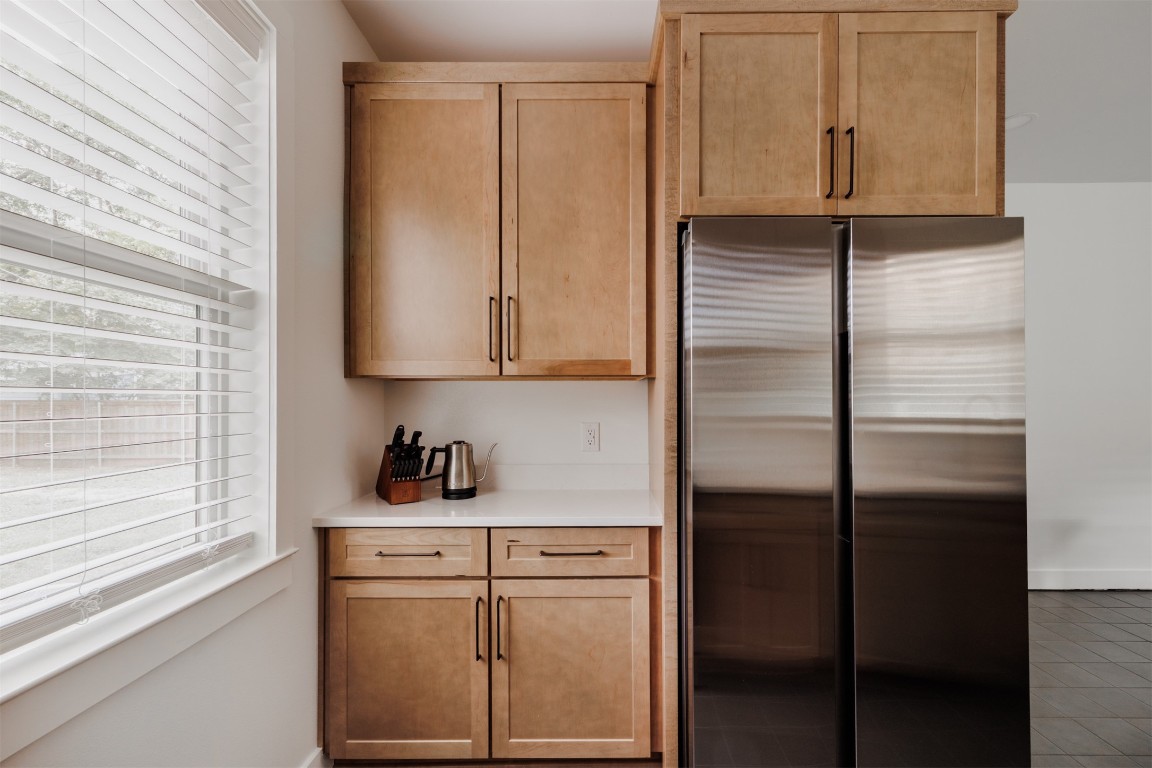 4007 Avenue F Austin, TX 78751 - Photo 11 of 35 a kitchen with a refrigerator and cabinets