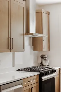 a kitchen with a stove and a refrigerator