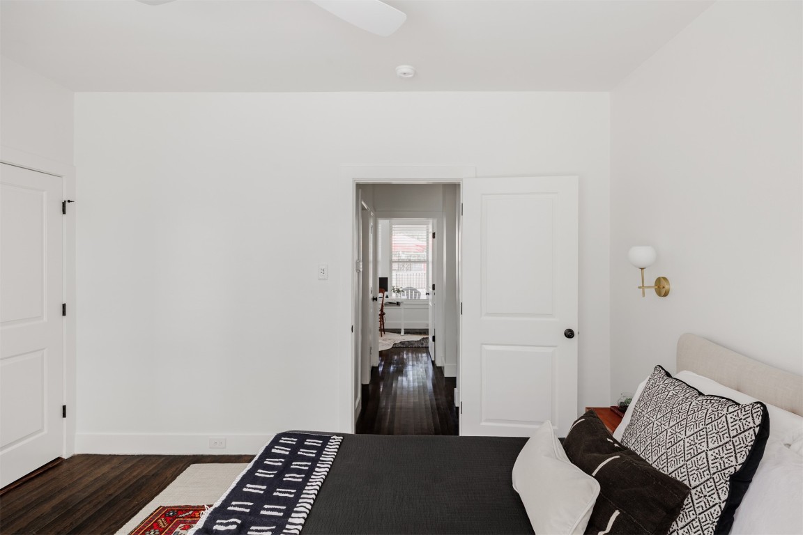 4007 Avenue F Austin, TX 78751 - Photo 18 of 35 a bedroom with a bed and wooden floor