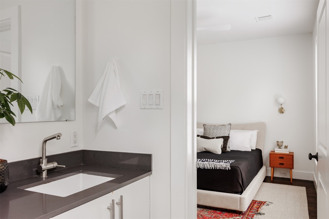 4007 Avenue F Austin, TX 78751 - Photo 19 of 35 a bedroom with a bed and a sink