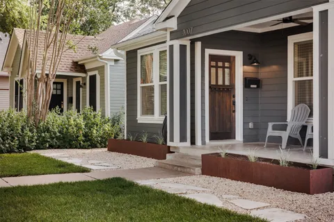 a front view of a house with garden