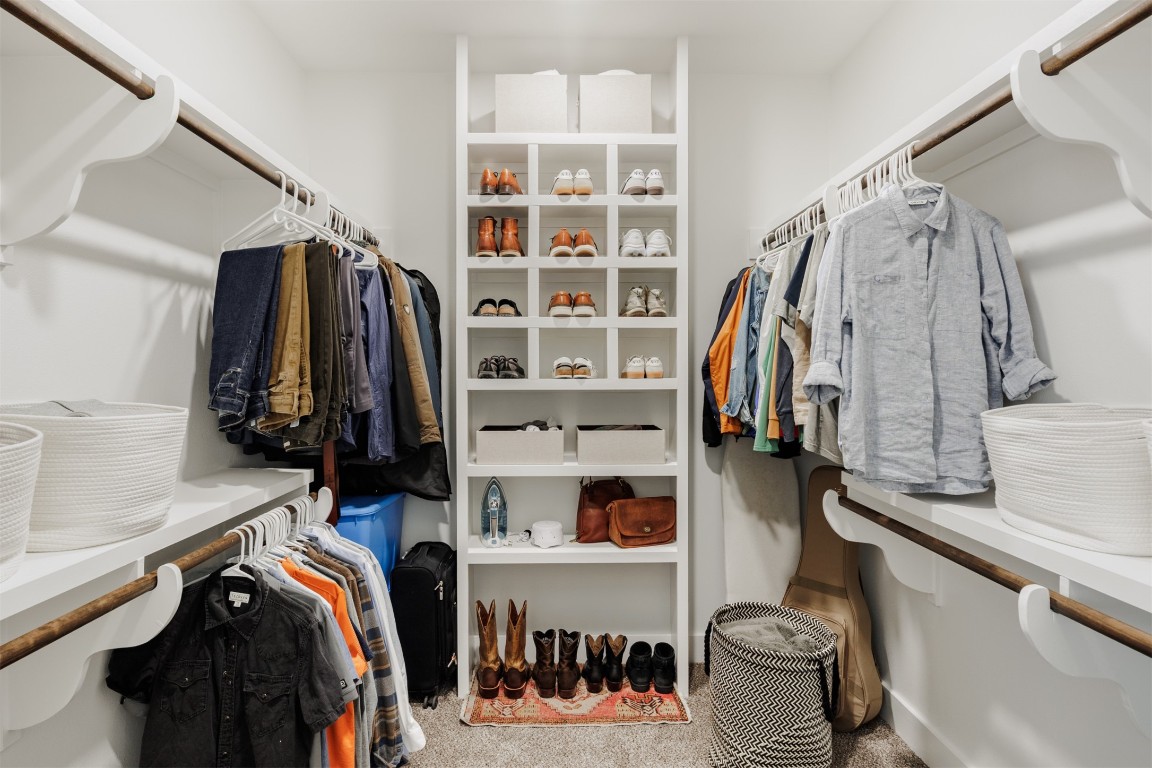 4007 Avenue F Austin, TX 78751 - Photo 24 of 35 a view of walk in closet with clothes and shoes