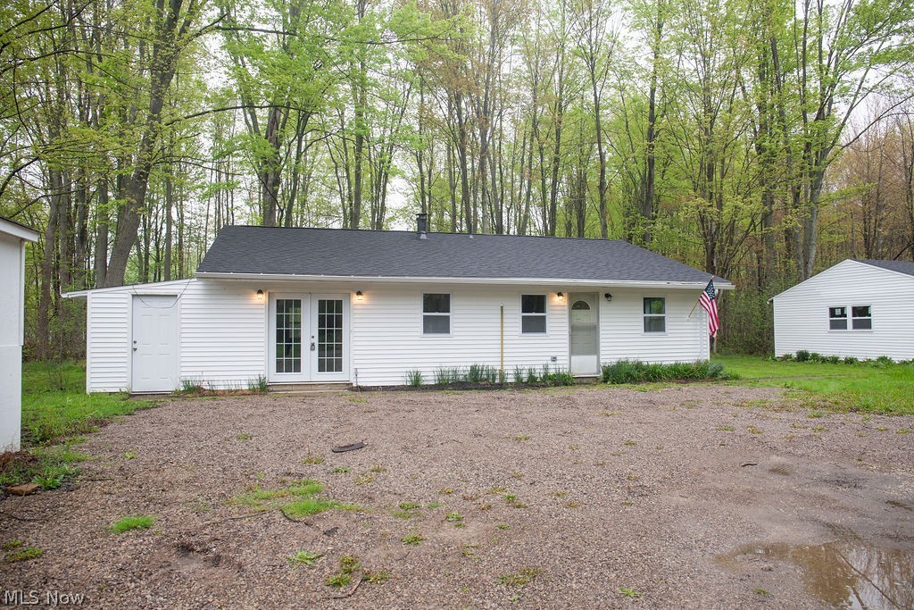 3644 Padanarum Road Geneva, OH 44041 - Photo 1 of 19 White vinyl siding residence with a dark shingle roof