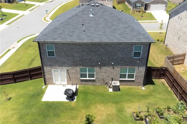 a aerial view of a house with swimming pool