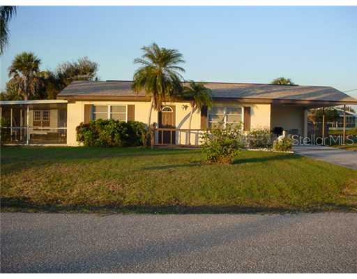 29098 Riverview Lane Punta Gorda, FL 33982 - Photo 1 of 1 a front view of a house with garden