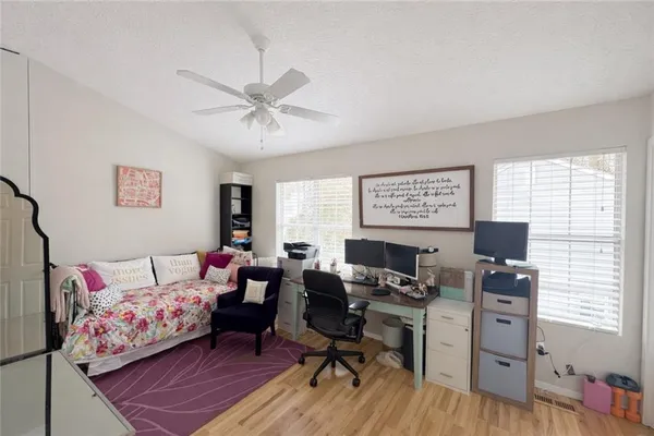 a workspace with furniture and a window