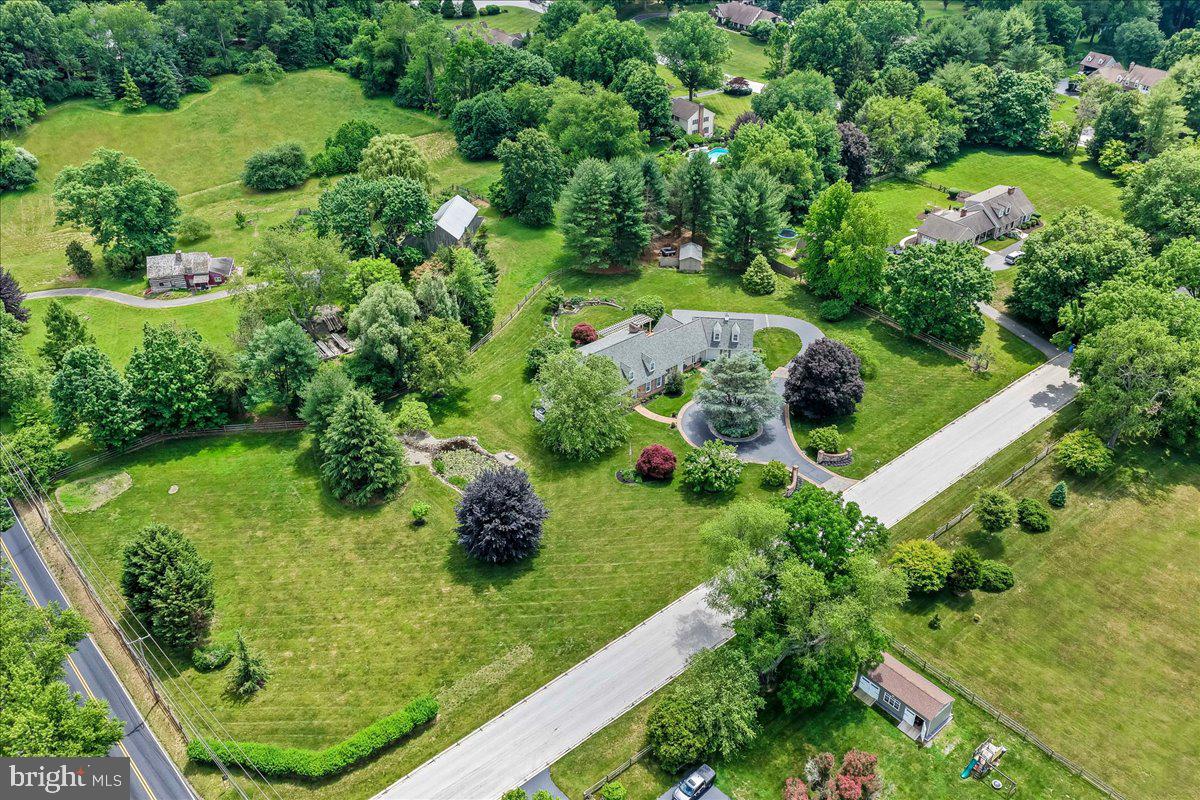 7 Bolingbroke Road West Chester, PA 19382 - Photo 51 of 86 Lush greenery surrounds a serene estate.