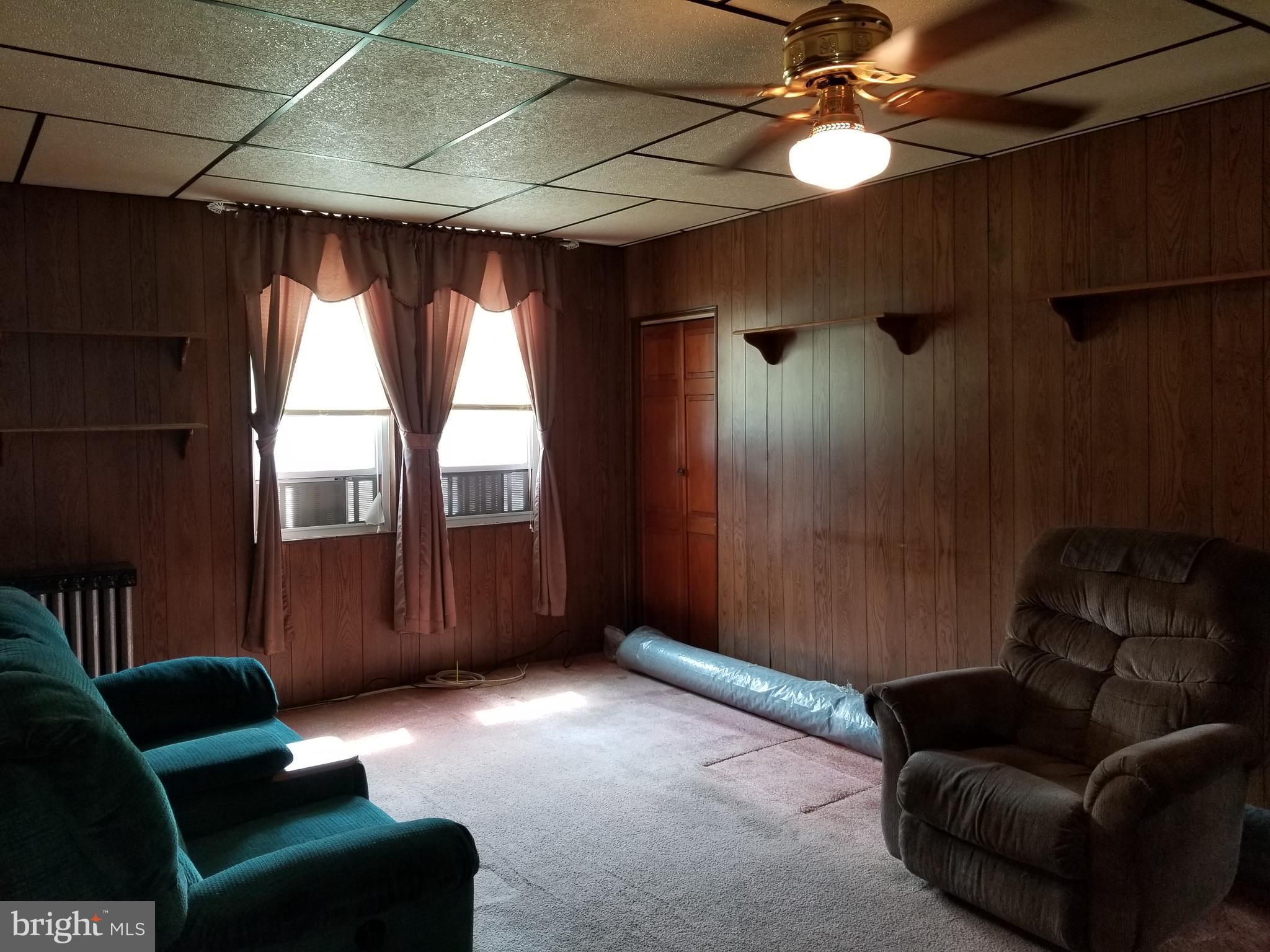 1115 Rosedale Avenue Baltimore, MD 21237 - Photo 19 of 27 a living room with furniture and a window