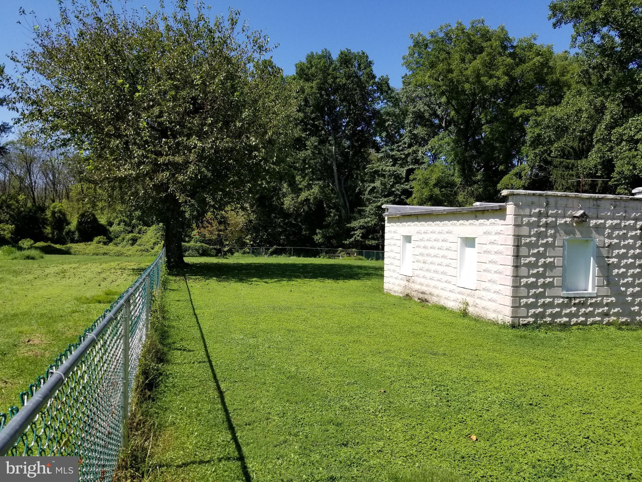 1115 Rosedale Avenue Baltimore, MD 21237 - Photo 25 of 27 a view of a garden with swimming pool