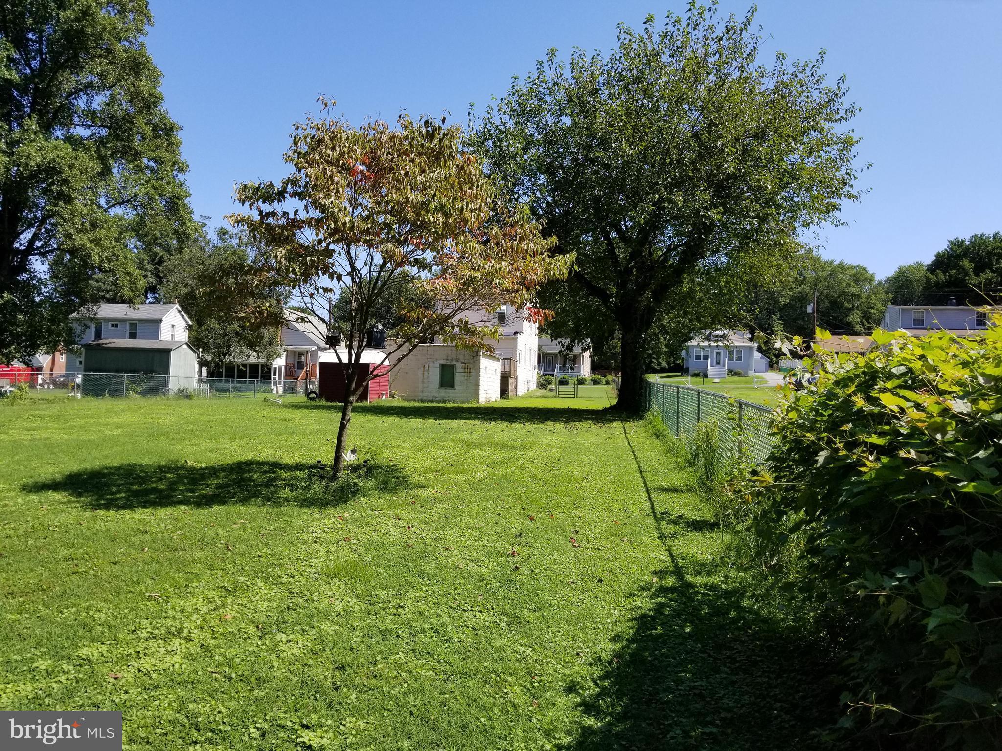 1115 Rosedale Avenue Baltimore, MD 21237 - Photo 26 of 27 a view of a park with large trees