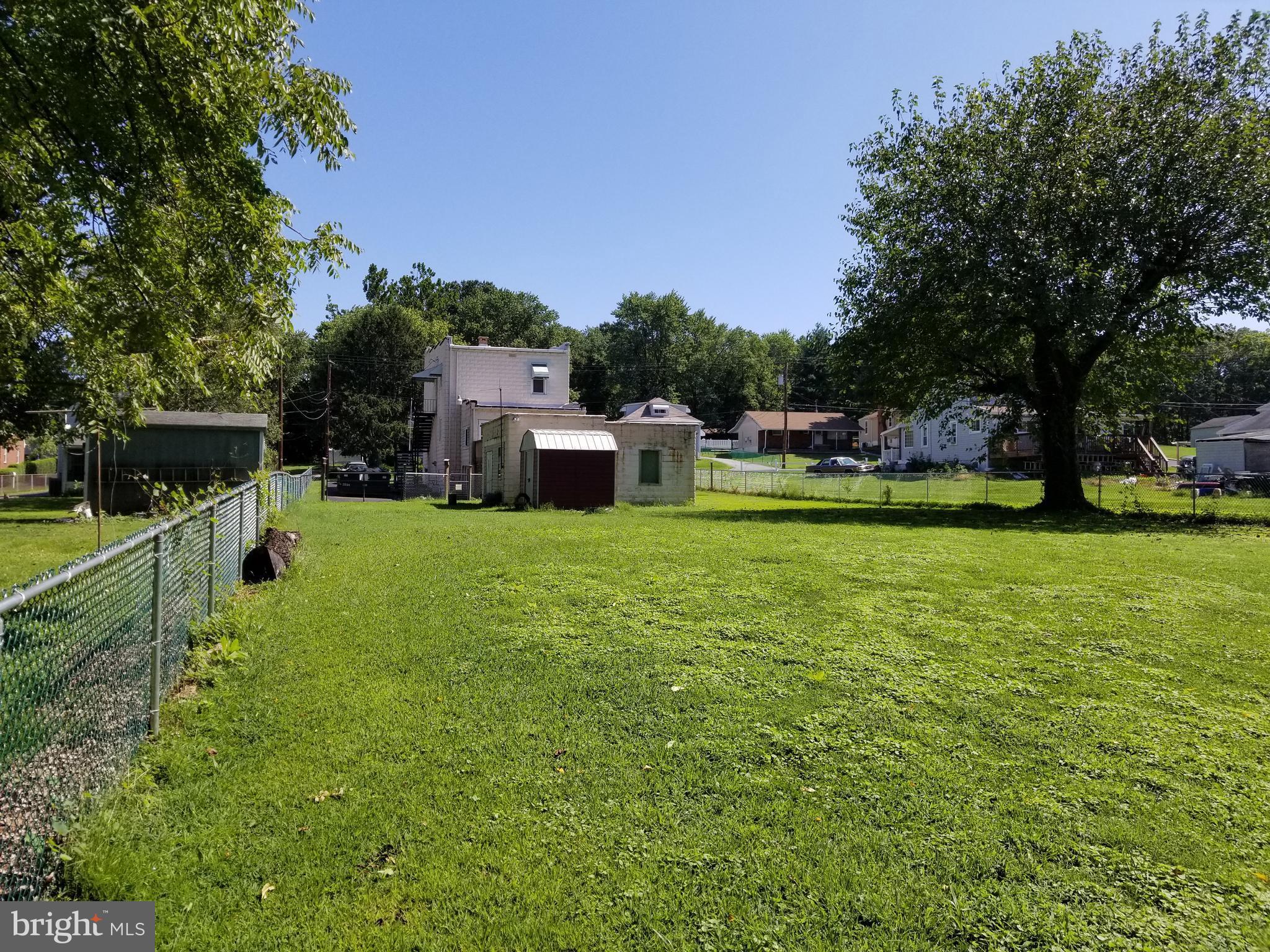 1115 Rosedale Avenue Baltimore, MD 21237 - Photo 27 of 27 a view of a house with a yard porch and sitting area