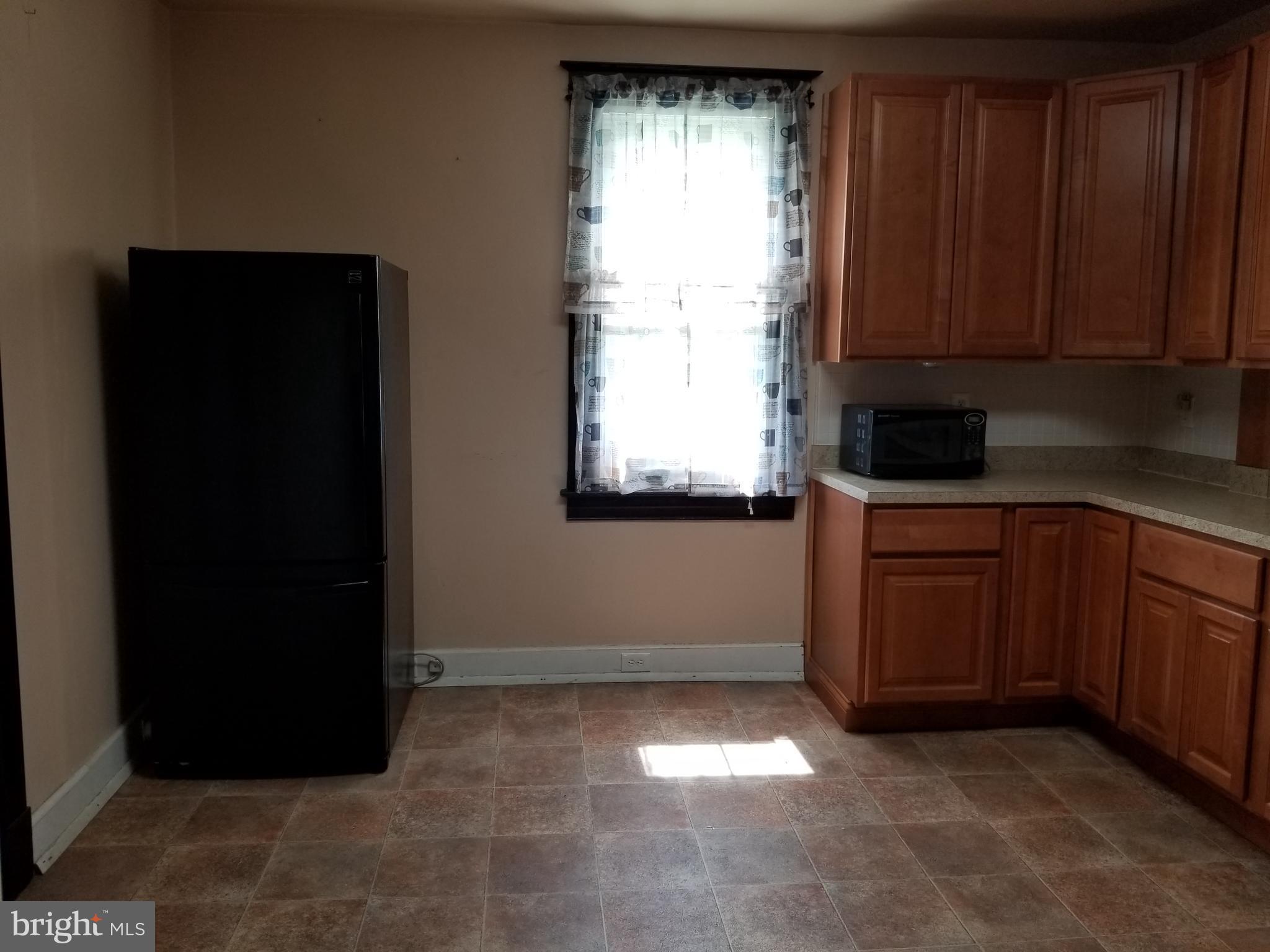 1115 Rosedale Avenue Baltimore, MD 21237 - Photo 6 of 27 a view of a kitchen with a sink