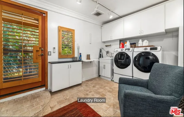 a storage room with washer and dryer
