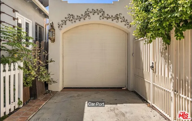 a view of a brick house with a small yard