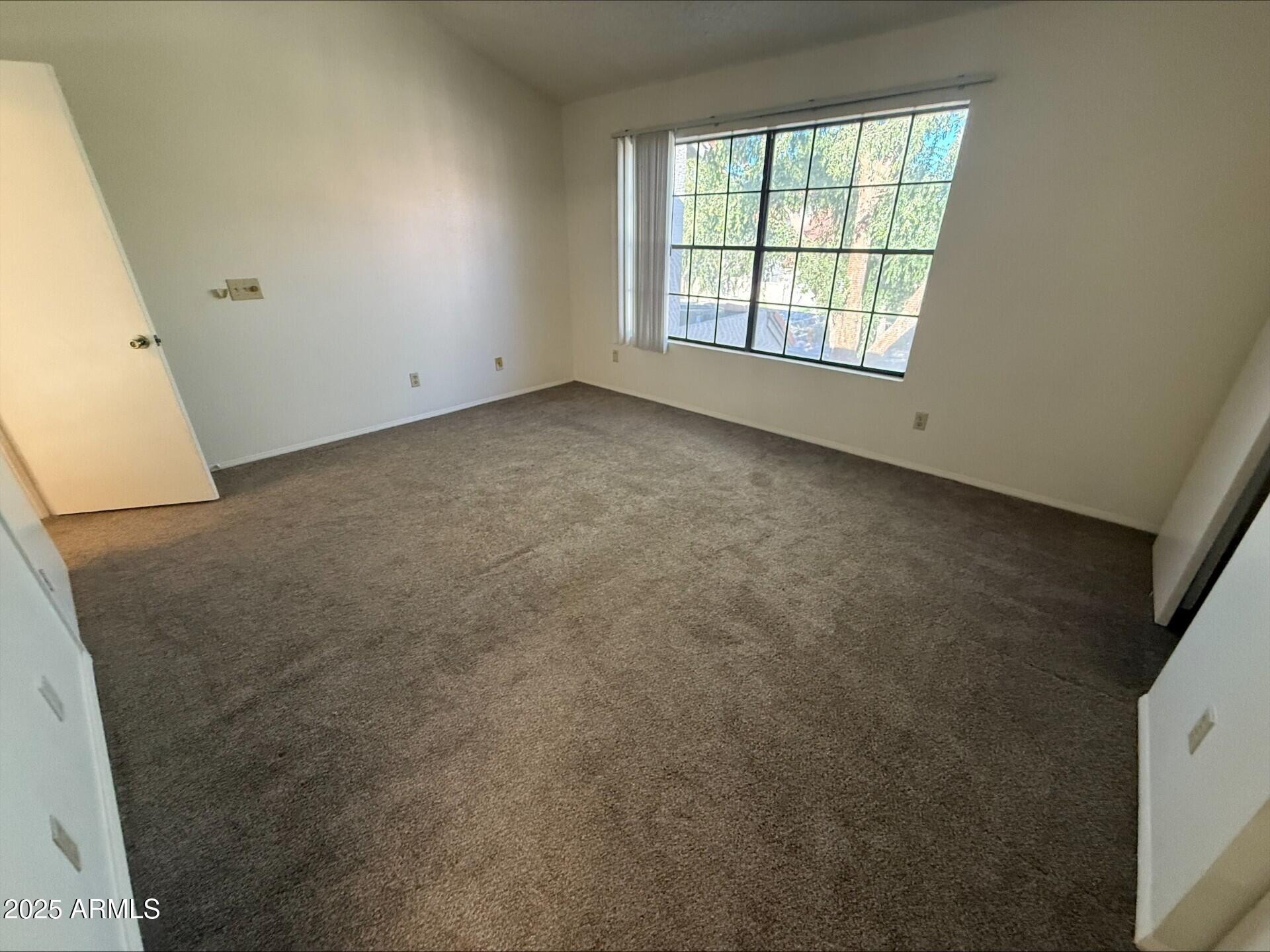 3930 West Monterey Street, Unit 113 Chandler, AZ 85226 - Photo 11 of 20 an empty room with a window
